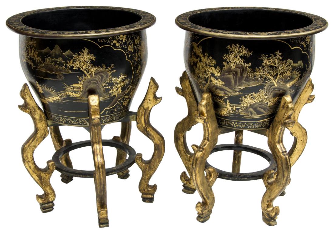 (2) BLACK LACQUER GILT PAPER MACHE FISH BOWLS: (pair) Black lacquer parcel gilt paper mache fish bowls, having wide mouth, over tapered body, with floral designs, and landscape medallions to exterior, foliate design to interior, rising on carved w