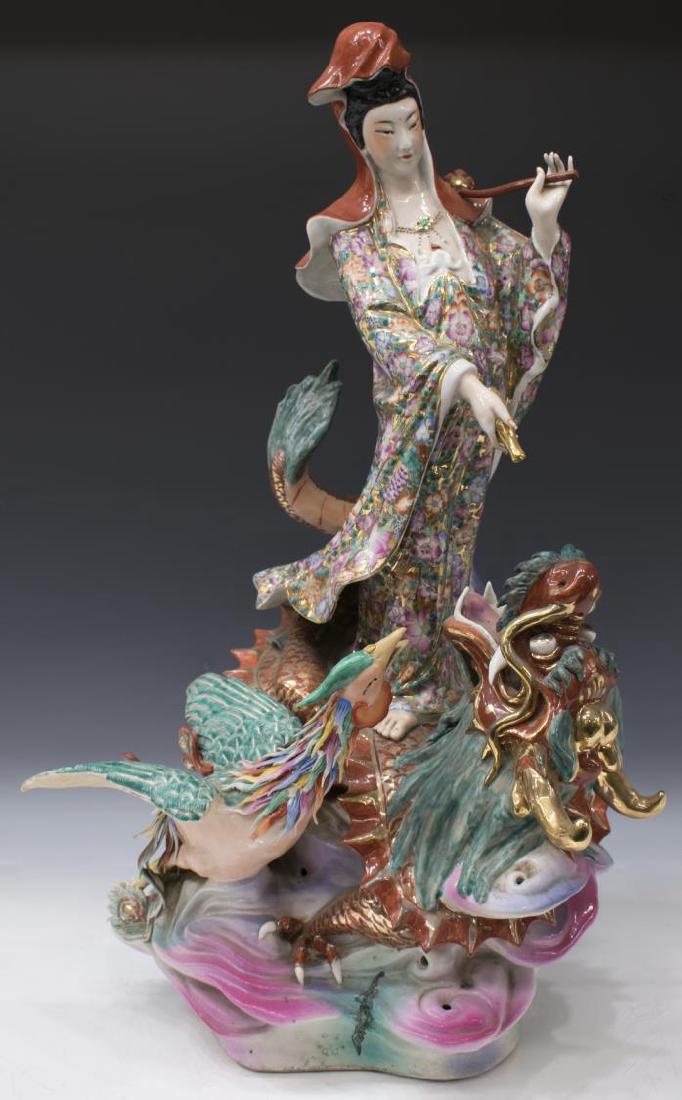 LARGE CHINESE FAMILLE ROSE FIGURAL GROUP: Large Chinese parcel gilt famille rose porcelain figural group, Quan Yin standing upon the back of a dragon, a phoenix bird to the side, all on a scrolling base, approx (for shipping only) 29"h, 15"l,
