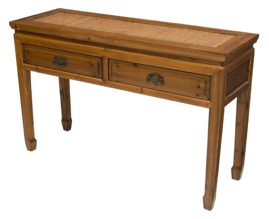 CHINESE ELMWOOD & WOVEN CANE CONSOLE TABLE: Chinese elmwood console table, rectangular top with woven cane panel, over two drawers with bat drawer pulls, rising on block legs, ending in hoof feet, approx 29.5"h, 47.25"w, 15.75"d Start Price: $1
