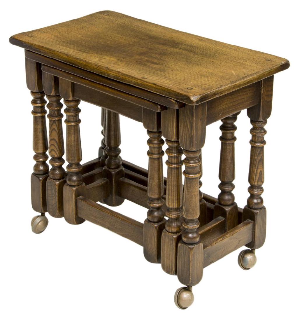 (3) ENGLISH OAK GRADUATED NESTING TABLES: (set of 3) English oak graduated nesting tables, c. 1960's, having rectangular top, rising on turned vase-and-ring-and-block legs, stretcher joined, largest table moving on ball feet, largest: approx 