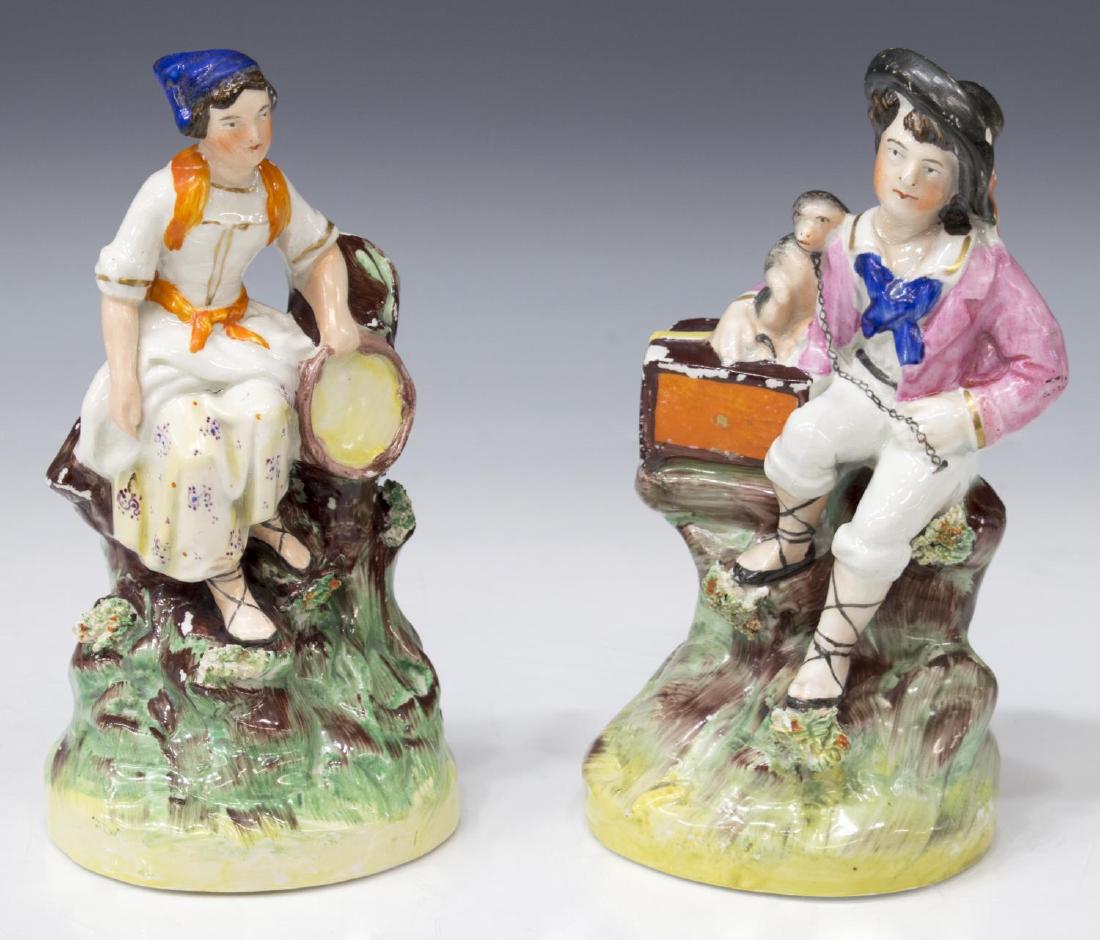 (PAIR) ENGLISH STAFFORDSHIRE FIGURES OF MUSICIANS: (pair) English Staffordshire mantle figures, mid 19th c., attributed to Thomas Parr, depicting an organ grinder with his monkey, and a peasant girl with tambourine, some loss to polychrome decoration,