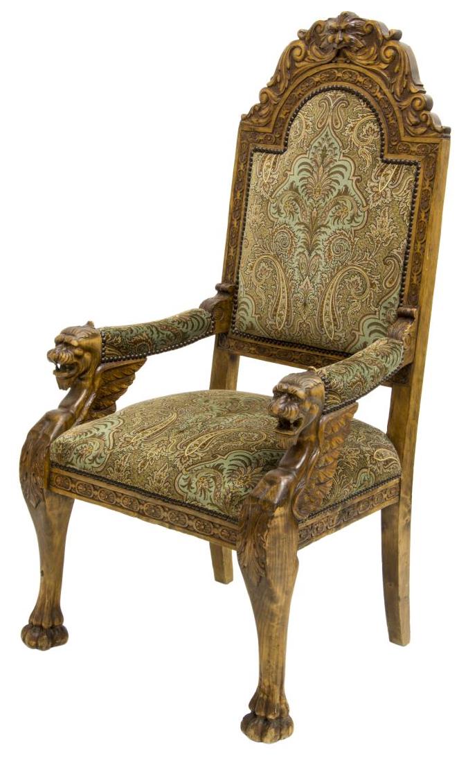 RENAISSANCE REVIVAL CARVED WINGED GRIFFIN ARMCHAIR: Renaissance revival armchair, late 19th c., carved scrolled top rail with central figural mask, over upholstered back, seat, and armrests, in paisley velvet textile held with brass tacks, flanked by c