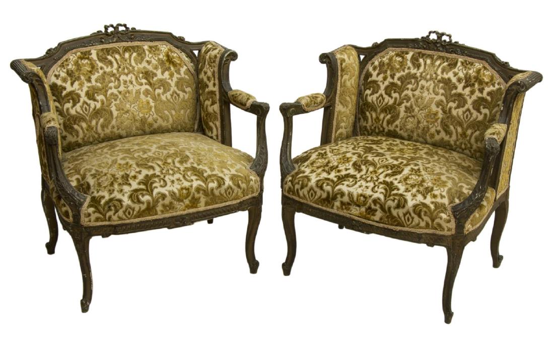 (2) ITALIAN LOUIS XV STYLE PARCEL GILT ARMCHAIRS: (pair) Italian Louis XV style parcel gilt wingback armchairs, early 20th c., having pierced and carved ribbon and foliate crest, over scrolled sides, and flared arms, with acanthus accents, having yel