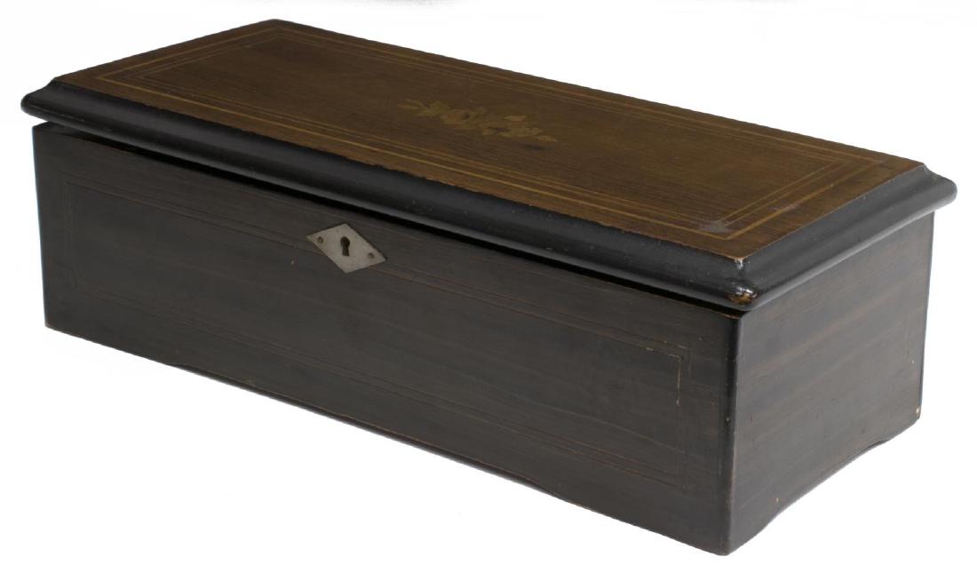 SWISS MUSIC BOX, OPERATING, FOLIATE INLAY CASE: Operating Swiss music box, 19th c., a rosewood case with foliate and string inlay at the hinged top the movement playing eight tunes, tune sheet and all comb teeth present, plays with excellent tone, 