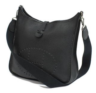 HERMES 'EVELYNE I GM' CLEMENCE LEATHER HANDBAG: Hermes "Evelyne I GM" shoulder bag, in black Clemence leather, with silver-tone hardware, woven shoulder strap, perforated logo to front face, top flap with snap closure to back, tonal suede lining, h