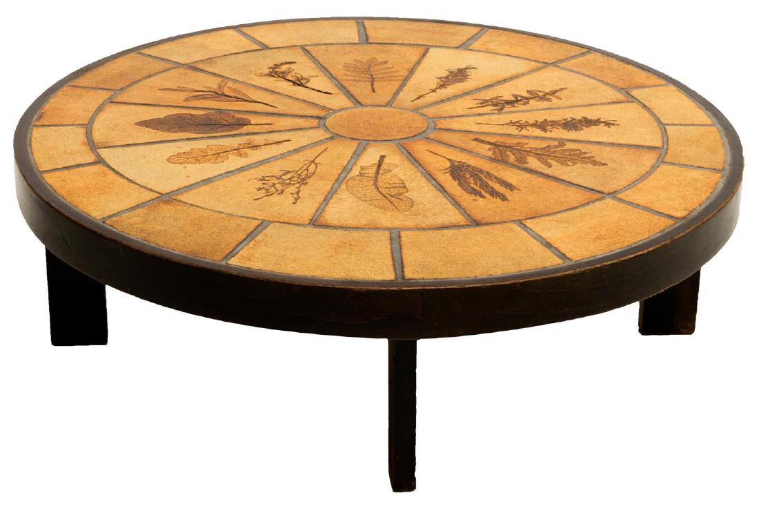 ROGER CAPRON (D.2006) MODERN CERAMIC COFFEE TABLE: Modernist coffee table, c. 1960s, oval wood frame, centering glazed earthenware tiled top, with impressed radiating leaf design, tiles signed R. Capron (Roger Capron, Vallauris, France, 1922-2006), al