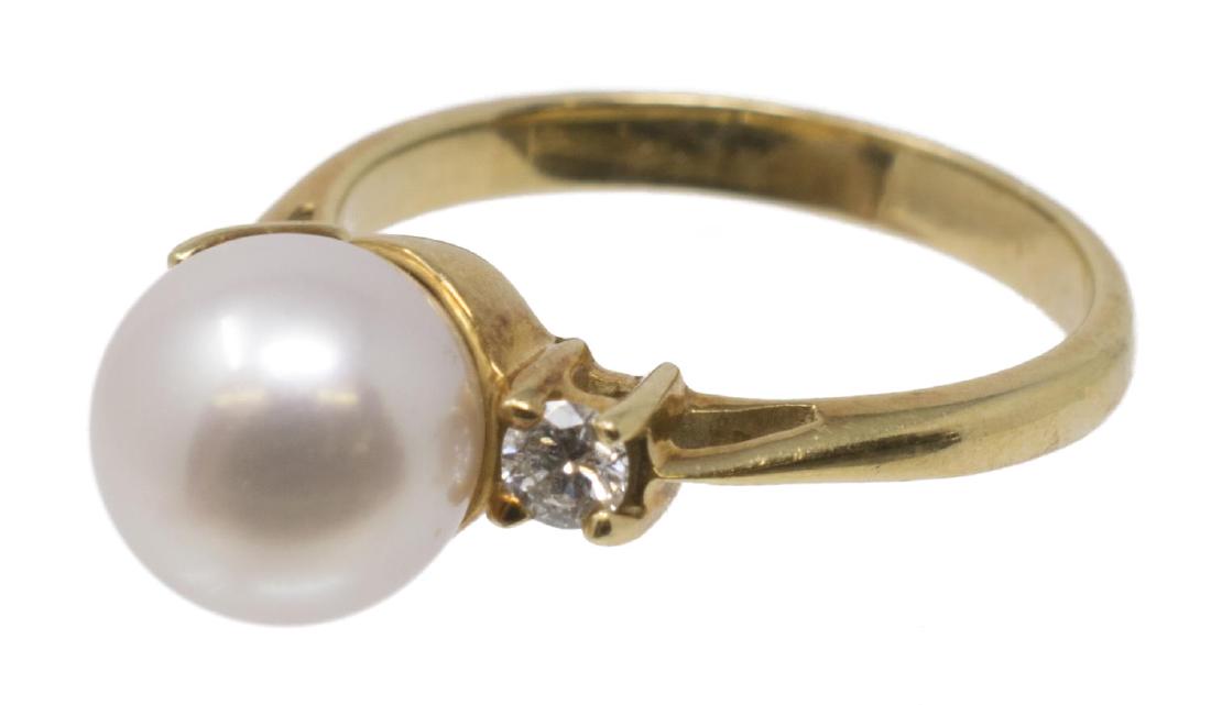 TIFFANY & CO PEARL & DIAMOND 18K YELLOW GOLD RING: Ladies Tiffany & Company 18kt yellow gold ring, set with (1) pearl and (2) small diamonds, stylized shank with textured finish, marked 750, approx size 4.5, 3.3 grams (inclusive of all material) Start