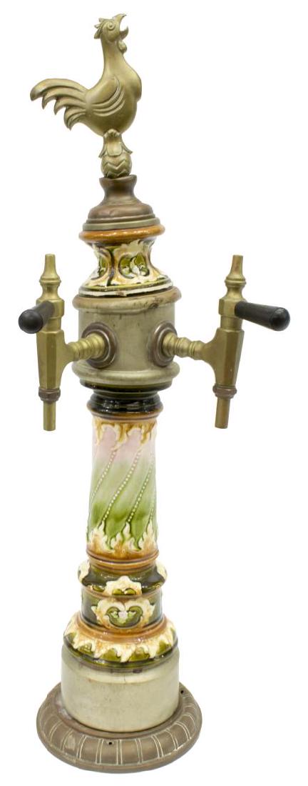 ANTIQUE BRASS & PORCELAIN ROOSTER DOUBLE BEER TAP: Antique double beer, c. 1900, the top with a crowing rooster above the two tap handles and lower polychrome body, marked at handles "Lebit", 31:h, 12"w, 9.5"d, 14lbs Start Price: $100.00