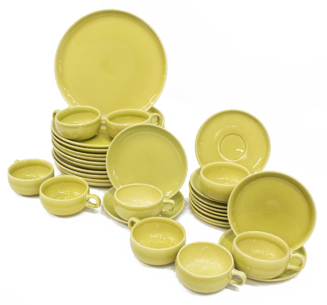 (32) RUSSEL WRIGHT AMERICAN MODERN DINNERWARE: (lot of 32) American Modern chartreuse dinnerware, designed by Russel Wright (United States, 1904-1976) for Steubenville Pottery, including: (11) dinner plates, 10"diam, (2) bread plates, 6"diam, (9)