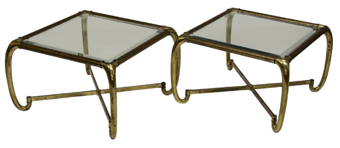 (PAIR) MASTERCRAFT MODERN BRASS COFFEE TABLES: (pair) Mastercraft modern coffee tables, mid 20th c., beveled glass tabletops, set in tubular brass frame, rising on upturned legs, joined by X stretcher, approx 15.5"h, 25.25"w, 25.25"d Start Price: