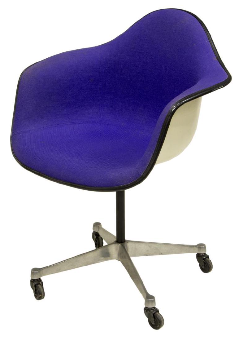 CHARLES & RAY EAMES HERMAN MILLER SHELL FORM CHAIR: Modern shell form office chair, mid 20th c., design by Charles and Ray Eames for Herman Miller, the fiberglass shell having purple upholstery, rising on chromed caster foot quadripartite base, makers