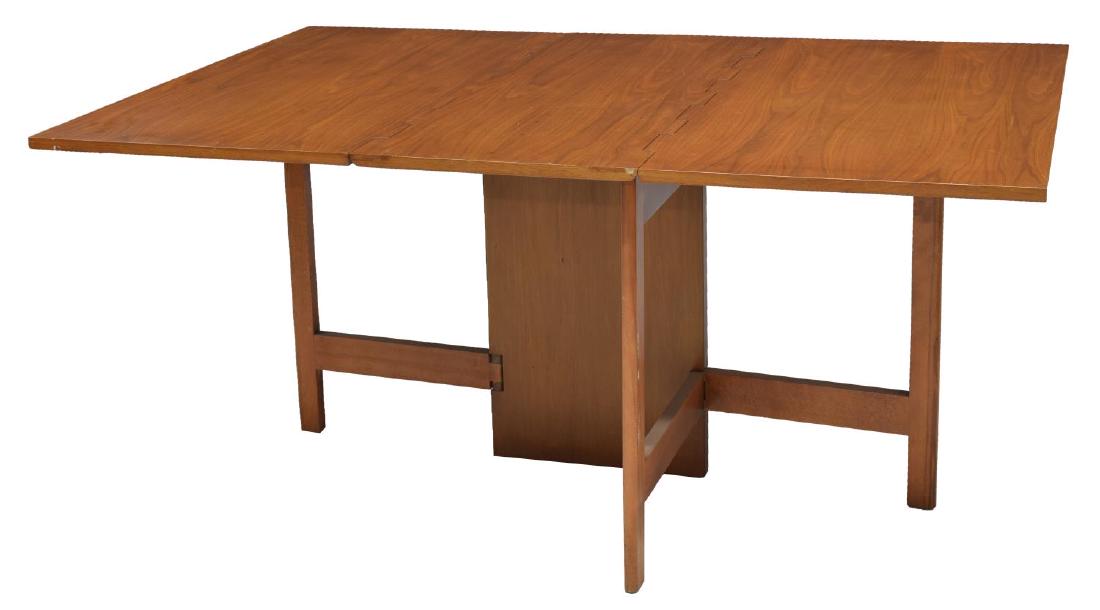 MID-CENTURY MODERN NELSON HERMAN MILLER TABLE 4656: Mid-century modern walnut drop-leaf table, c. 1946, designed by George Nelson (United States, 1908-1986) for Herman Miller, table with exposed hinges, retaining Miller tag and model number at undersid