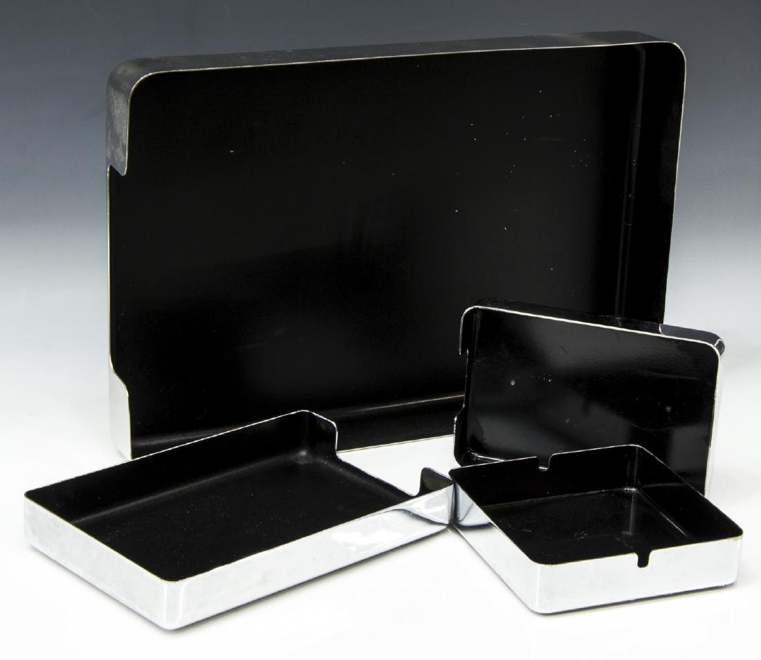 (4) MID-CENTURY 'RADIUS ONE' DESK ACCESSORIES: (lot of 4) Mid-century modern "Radius One" desk accessories, designed by William Sklaroff for McDonald Products, mirrored stainless steel, including: (1) single letter tray, 2.25"h, 15.5"w, 10.25"d, (