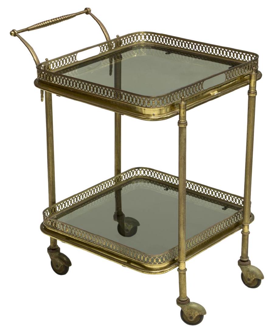 DIMINUTIVE ITALIAN BRASS TWO-TIER SERVICE CART: Diminutive Italian brass service cart, two tiers having pierced borders, set with glass, rolling on wheels, approx 22.5"h, 14"w, 16"d Start Price: $100.00