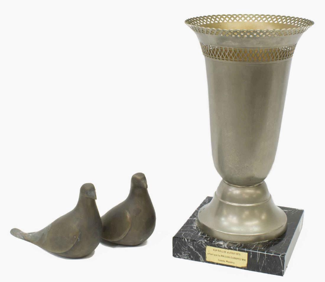 CONTINENTAL BRONZE BIRD MODELS & TROPHY ON MARBLE: (lot) Continental metal decor: (pair) bronze birds, Two Doves, unsigned, approx 5.75"h, 7.25"l; (1) large pierced metal trophy urn having reticulated flared rim, metal plate reading "XXIo Rallye du Va