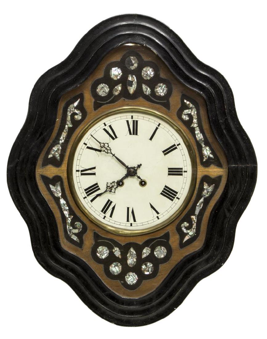 NAPOLEON III EBONZIED & INLAID SHAPED WALL CLOCK: Napoleon III wall clock, mid to late 19th c., ebonized wood frame, enclosing a glass pane, over walnut case, with decorative inlays of mother-of-pearl and contrasting wood, centering circular white en
