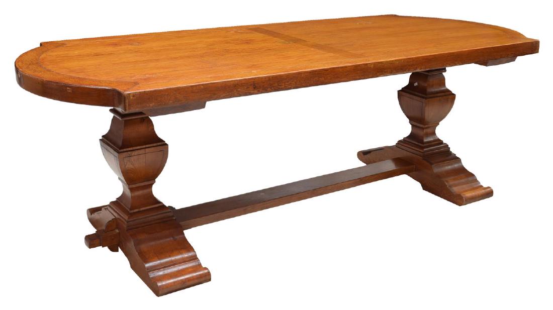 JACOBEAN STYLE OAK DOUBLE PEDESTAL DINING TABLE: Jacobean style oak double pedestal dining table, the shaped top rising on stretcher-joined trestle legs, approx 30.5"h, 90.5"w, 37.5"d Start Price: $200.00
