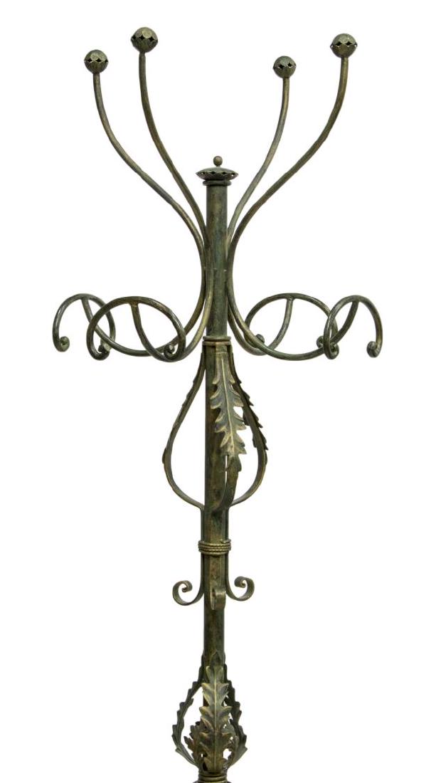 IRON SCROLLED FOLIATE STANDING COAT RACK HALL TREE: Iron hall tree, 20th c., with four hat and coat hooks, over vertical standard with applied scrolls and foliates, rising on tripartite scrolled base, approx 74"h Start Price: $100.00
