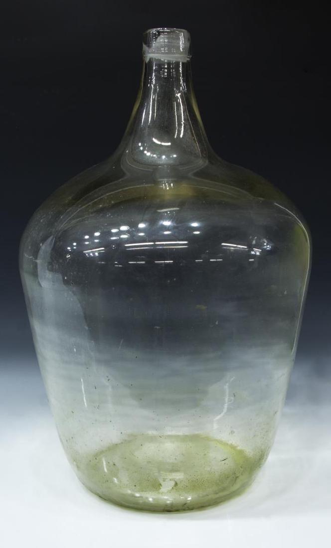 LARGE FRENCH GLASS WINE BOTTLE, 26.75"H: French glass wine bottle, late 19th/ early 20th c., out of a Bordeaux cellar, approx 26.75"h, 17"diam, 22.25lbs Start Price: $60.00
