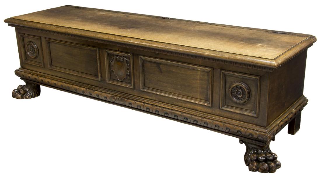 ITALIAN RENAISSANCE REVIVAL CARVED WEDDING CHEST: Italian Renaissance Revival carved wedding chest, early 20th c., the hinged top opening to interior storage, over front carved with floral and shield reserves, rising on large paw feet, approx 22"h, 7