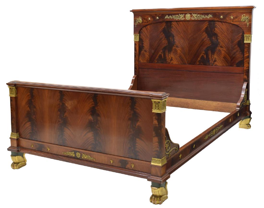 FRENCH EMPIRE STYLE MAHOGANY GILT ORMOLU BED: French Empire style mahogany bed, late 19th c., having gilt brass ormolu to headboard, footboards, and rails, rising on green and gilt painted paw feet, exterior: approx 55.75"h, 82.75"l, 63.75"w, int