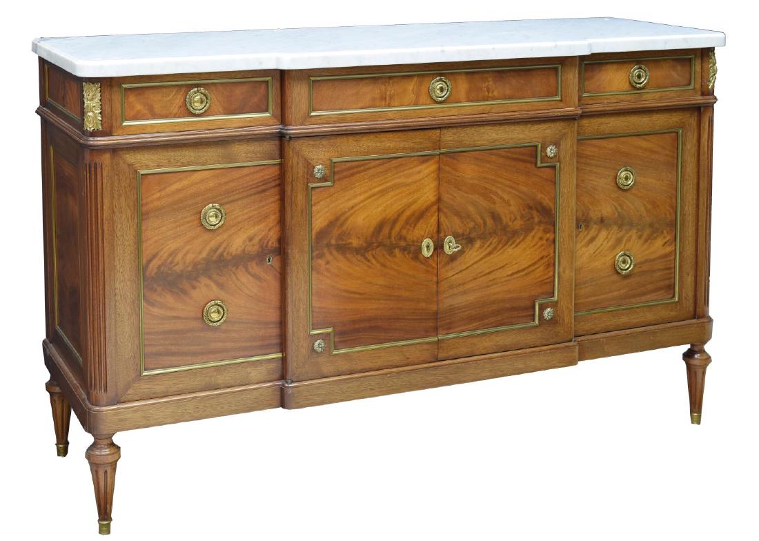 FRENCH EMPIRE STYLE MAHOGANY MARBLE TOP SIDEBOARD: French Empire style mahogany sideboard, early 19th c., the shaped marble top over a conforming base with gilt brass ormolu and hardware, fitted with three short drawers and three cabinets with shelves
