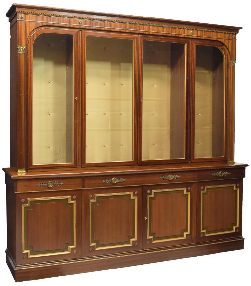 FRENCH EMPIRE MAHOGANY ORMOLU DISPLAY CABINET: French Empire style mahogany display cabinet, with gilt brass ormolu, the corniced and molded top over three glass front cabinets with shelves to interior, above four short drawers and three cabinets 