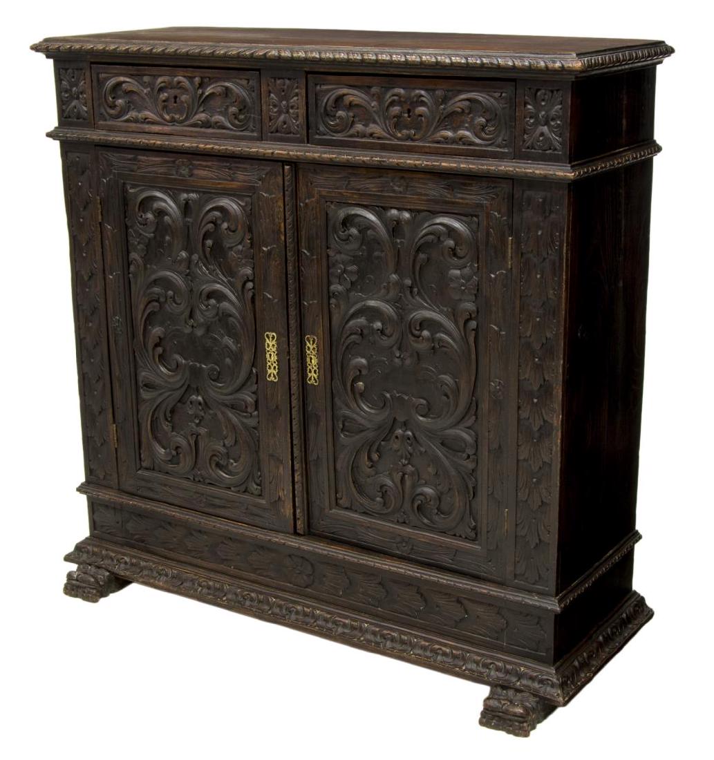 SPANISH CARVED RENAISSANCE REVIVAL SIDEBOARD: Spanish Renaissance revival oak sideboard, 19th c., the front highly carved in foliate designs with two drawers over two doors, rising on a the protruding base with mask feet, 47"h, 48"w, 19.5"d Start