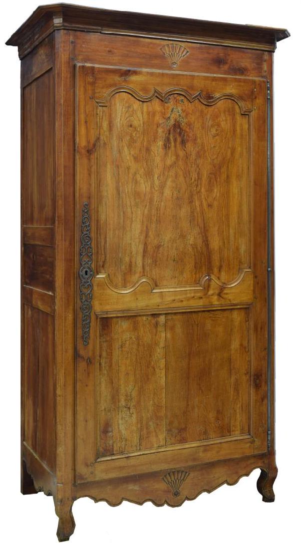 LOUIS XV STYLE FRUITWOOD ARMORIE, MID 19TH C.: Louis XV style fruitwood armoire, mid 19th c., a corniced top over a frieze carved with a simple fan design, fitted with single cabinet door with long single hinge and open interior, rising on cabriol