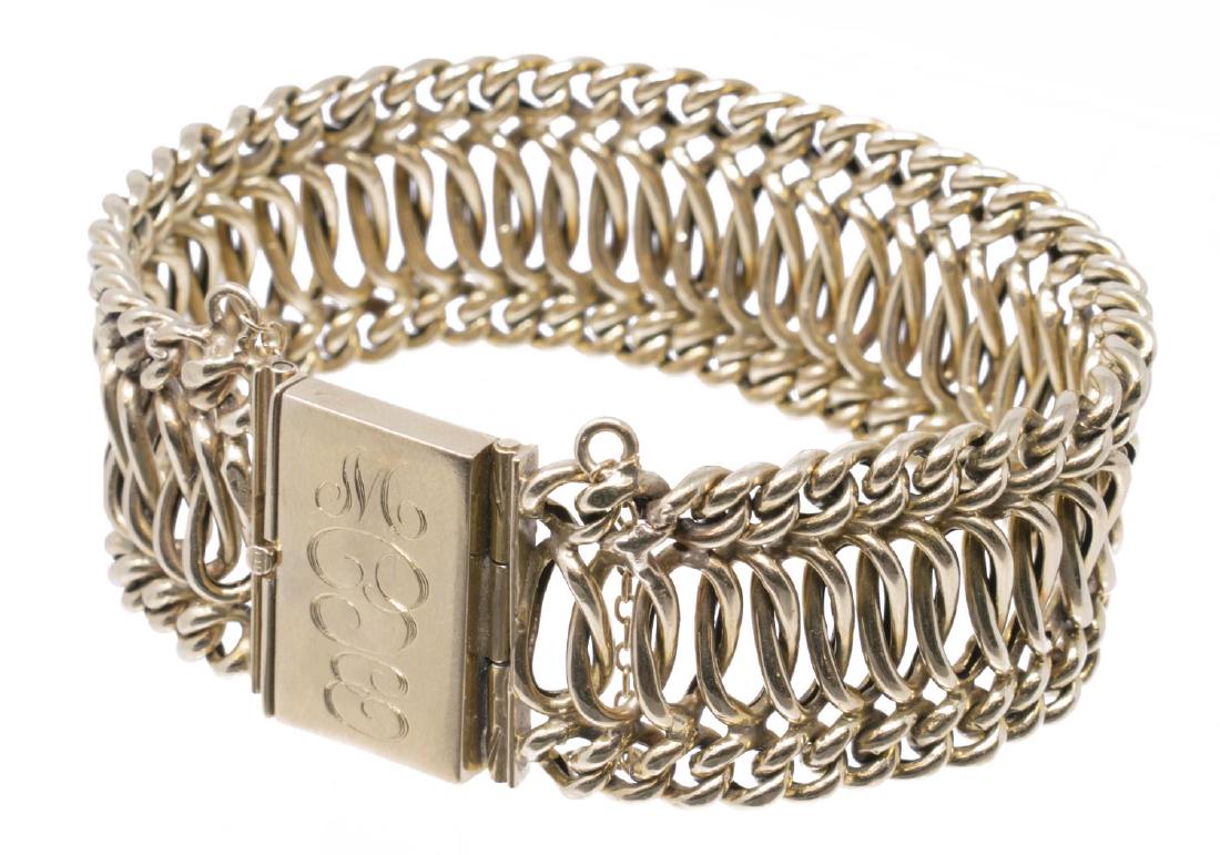 LADIES ESTATE 14KT YELLOW GOLD WOVEN BRACELET: Estate 14kt yellow gold bracelet, thick interlocked woven band joined by a wide clasp, with engraved triple monogram, safety chain, approx .75"w, 7.5"l, 33.6 grams Start Price: $550.00