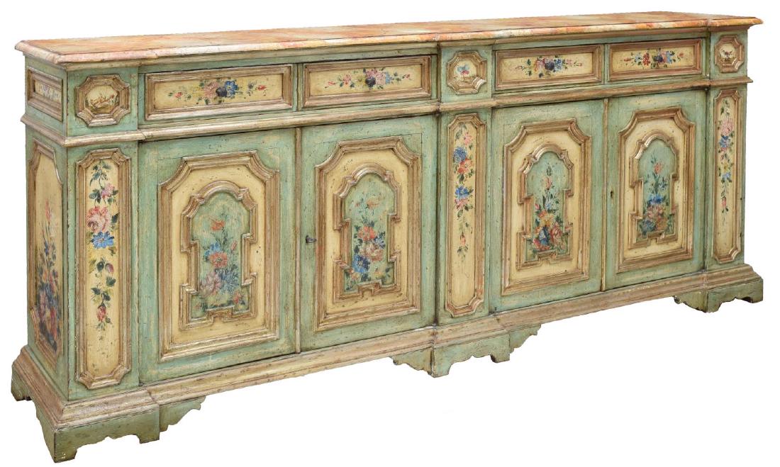 VENETIAN PAINTED FLORAL PARCEL GILT SIDEBOARD: Venetian floral painted parcel gilt sideboard, the shaped marbelized top above a conforming body fitted with four drawers and two two-door cabinets, rising on bracket feet, restoration to back foot, a