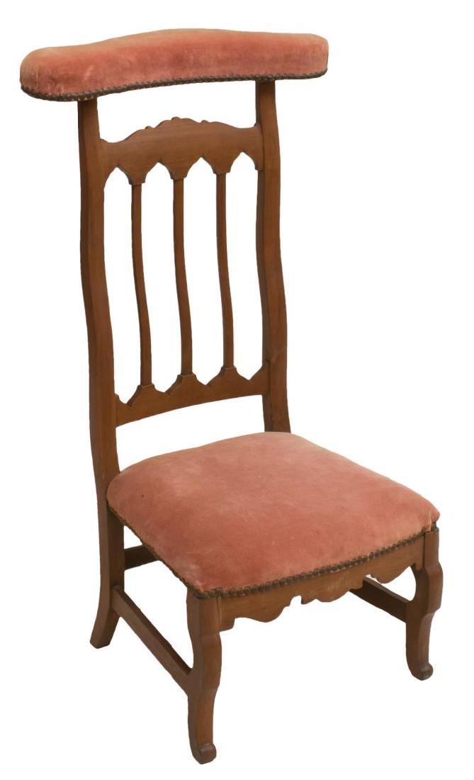 FRENCH CARVED FRUITWOOD PRAYER CHAIR: French carved fruitwood prayer chair, 19th c., having polychrome floral upholstery with nail head accents, pierced Banister back and rising on stretcher joined S-shaped legs, approx 32.5"h, 20.25"w, 1