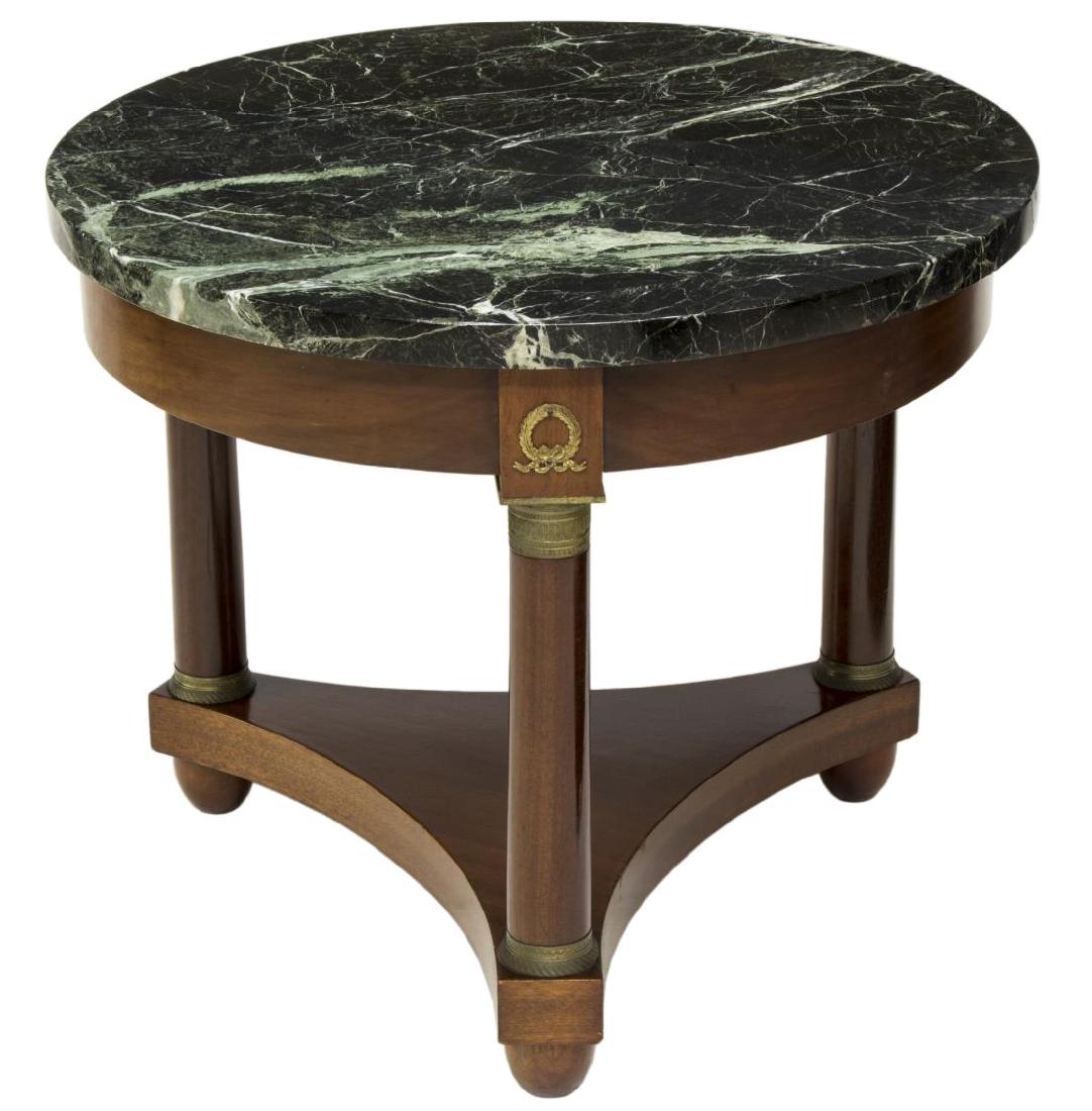 FRENCH EMPIRE STYLE MARBLE TOP SOFA TABLE: French Empire style sofa table, having round marble top rising on hardwood base with gilt brass ormolu, turned supports on bun foot tripartite base, repair to top, approx 21.5"h, 25.75"diam Start Pric