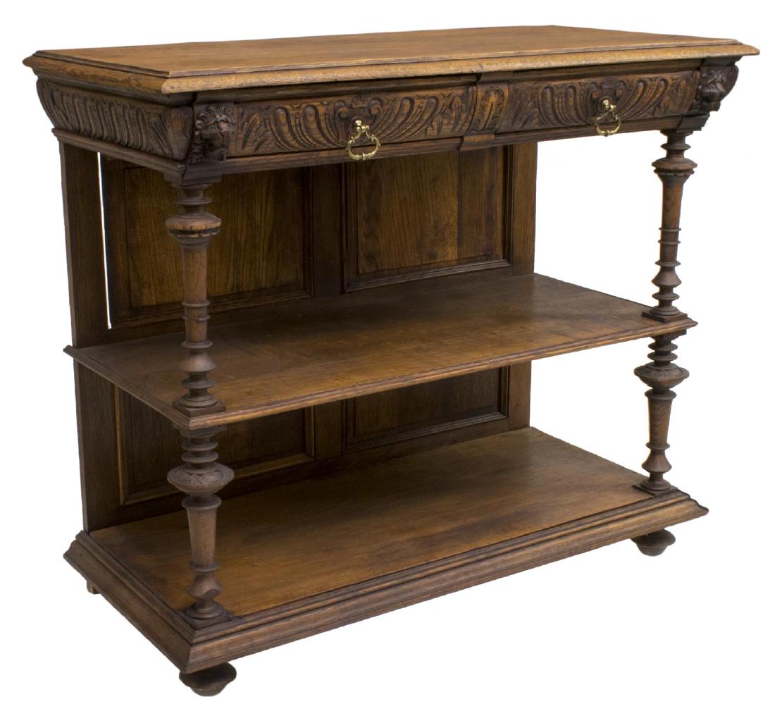 FRENCH OAK MULTI-TIER SERVER: French oak server, late 19th/ early 20th c., rectangular top, over lion's mask brackets, and two drawers with well-carved drawer fronts, two lower shelves with paneled backs, joined by turned supports