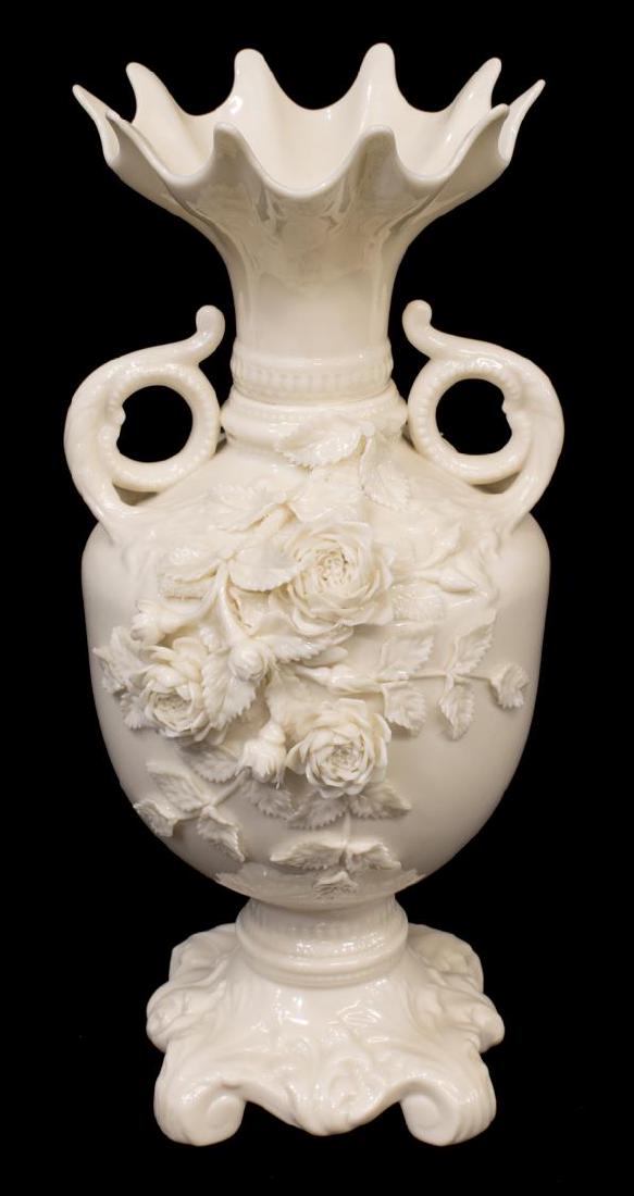 LARGE BELLEEK ROSE ISLE PORCELAIN VASE, 5TH MARK: Belleek Rose Isle porcelain vase, c. 1955-1965, footed urn form, with two scrolling handles, cluster of applied flowers to front face, single flowering branch on reverse, green 5th mark underfoot, 12.