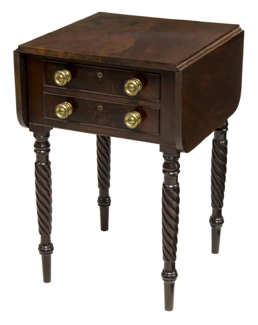 AMERICAN EMPIRE STYLE DROP LEAF SIDE WORK TABLE: American Empire style drop leaf side/work table, with mahogany finish, c. 1820's, fitted with two drawers, with gilt brass knobs, rising on turned twist legs, and arrow feet, with leaves extended: app