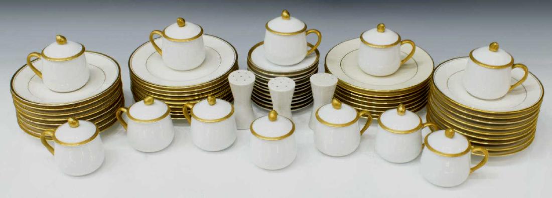 (61) GILT PORCELAIN TABLEWARE GROUP, FITZ & FLOYD: (lot of 61) Gilt porcelain tableware, including: (12) Fitz & Floyd covered cups, 3.25"h, (12) Fitz and Floyd corresponding saucers, 4.25"diam, (17) Noritake "Linton" bread and butter plates, 6.5"diam,