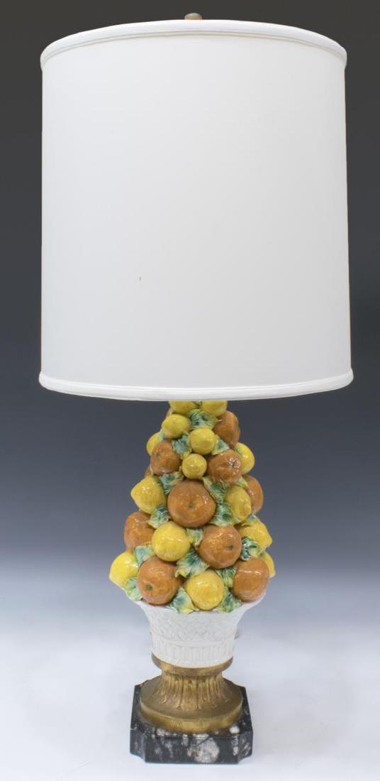 CERAMIC FRUIT BASKET TABLE LAMP, MARBLE BASE: Ceramic table lamp, 20th c., turned wood finial over harp holding fabric shade, rising on standard shaped like a large pile of oranges and lemons in a basket, rising on shaped marble base, approx 35.7