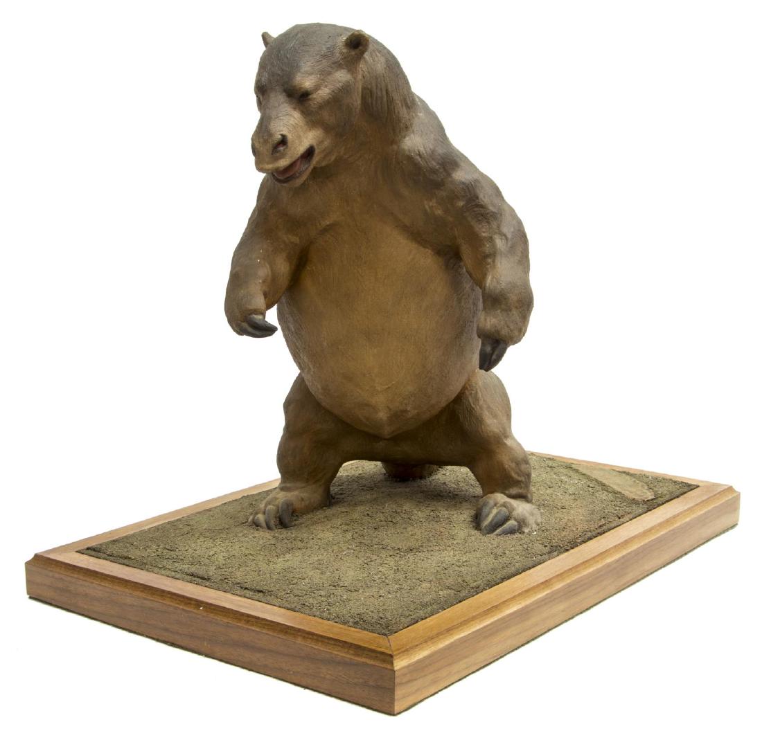 LOUIS PAUL JONAS STUDIOS GIANT GROUND SLOTH FIGURE: Louis Paul Jonas (American, 1894-1971) Studios wildlife sculpture, Megatherium (Giant Ground Sloth), signed and numbered 1/89 on back right, slight cracking to paint on tail as pictured, approx 15.5"h