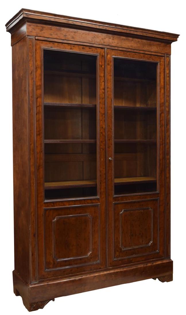 FRENCH DOUBLE DOOR BOOKCASE, 86"H: French double door bookcase, 19th c., having a stepped cornice over two glazed top doors with paneled lower sections, both opening to adjustable height shelves, all rising on bracket feet, 86"h, 55"w,