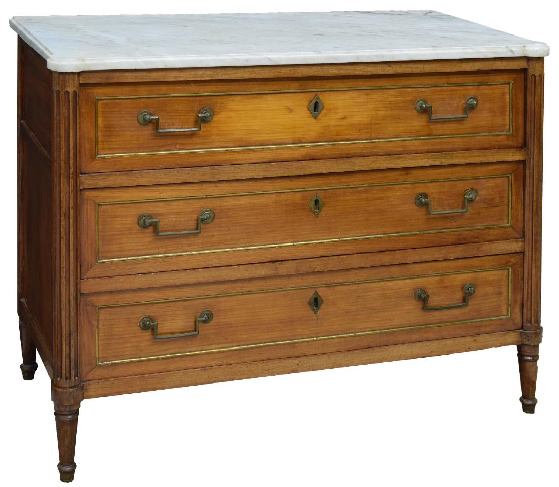 FRENCH DIRECTOIRE CHERRYWOOD MARBLE TOP COMMODE: French Directoire cherrywood commode, late 18th/early 19th c., the shaped marble top over a conforming body with fluted sides, fitted with three drawers, rising on turned tapered legs, approx 35.25"h,