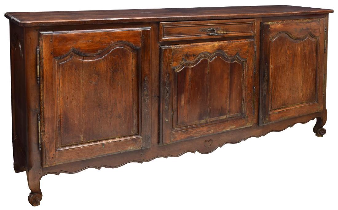 FRENCH LOUIS XV STYLE CARVED OAK ENFILADE, 19TH C.: French Louis XV style carved oak sideboard, 19th c., the shaped top over one short drawer and three cabinet drawers with shelves to the interior, rising on scroll foot cabriole legs, approx 43.75"h, 9