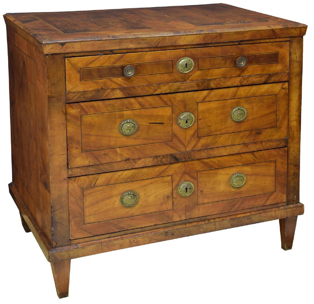 FRENCH LOUIS XVI STYLE WALNUT COMMODE: French Louis XVI style walnut commode, 19th c., with contrasting and string inlay, body fitted with three long drawers and rising on square tapered legs,approx 34.75"h, 37.75"w, 24.5"d Start Price: $6