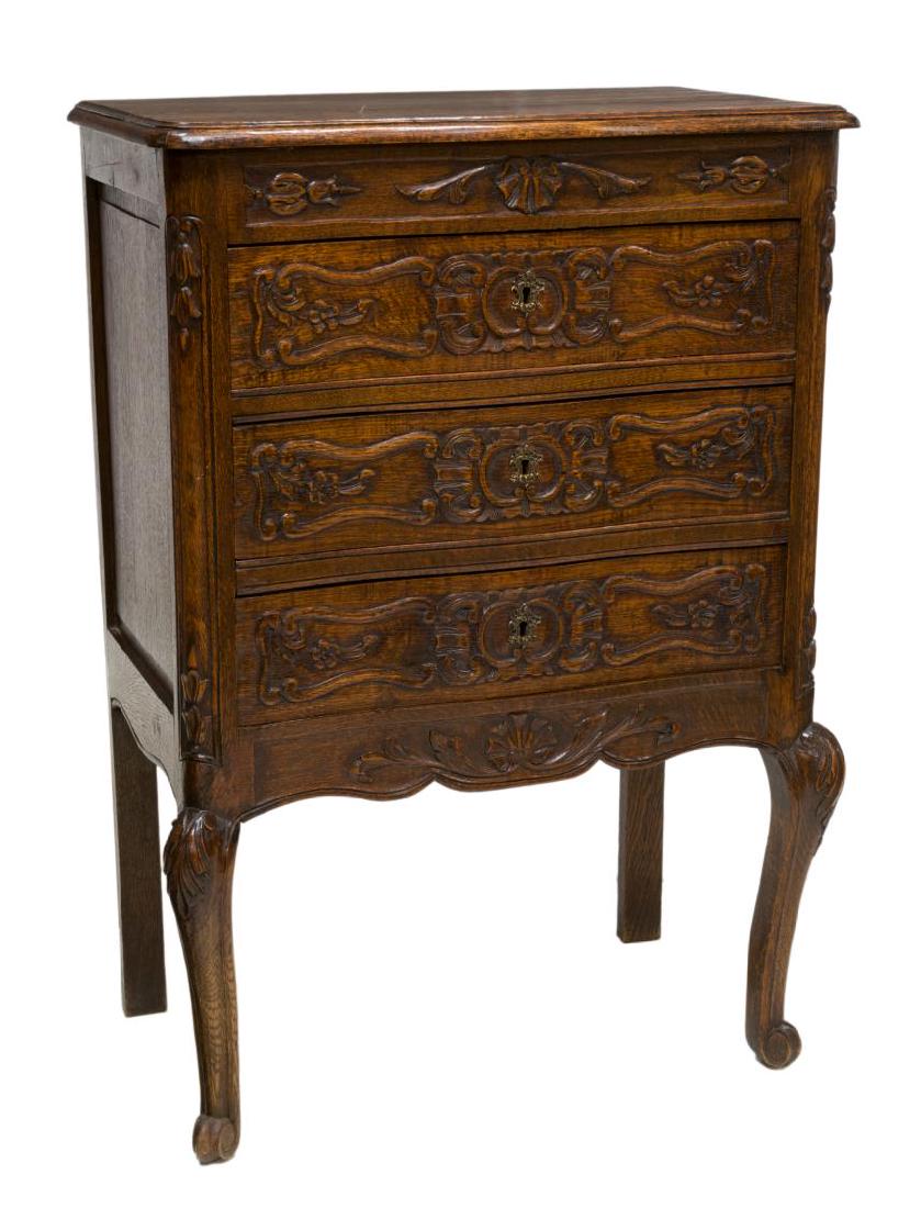 FRENCH LOUIS XV STYLE OAK DIMINUTIVE COMMODE: French Louis XV style diminutive commode, late 19th c., oak case fitted with three drawers, all with carved fronts, over carved and scalloped apron, rising on front cabriole legs with carved acanthus 