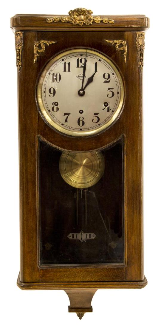 FRENCH MAHOGANY CASED VEDETTE CHIMES WALL CLOCK: French Vedette wall clock, early 20th c., mahogany case with gilt metal accents, housing time, strike, and chime movement with Westminster chimes, retains pendulum, approx 31"h, 12.5"w, 7"d, 20.25lbs