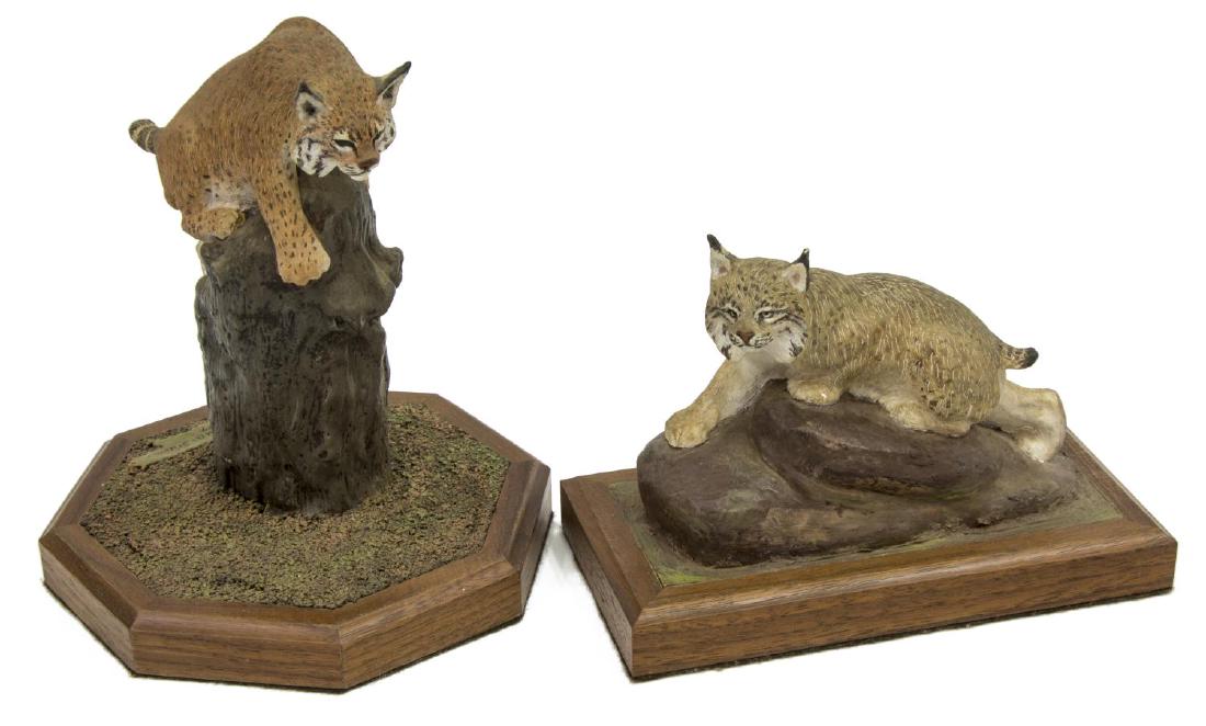 (2) LOUIS PAUL JONAS STUDIOS LYNX & BOBCAT FIGURES: (lot of 2) Louis Paul Jonas (1894-1971) Studios wildlife sculptures, signed and numbered, including: (1) Bobcat in Tree, numbered 2/89; (1) Lynx, numbered 2/89; largest: approx 6.75"h, 5.75"w, 5.75"d;