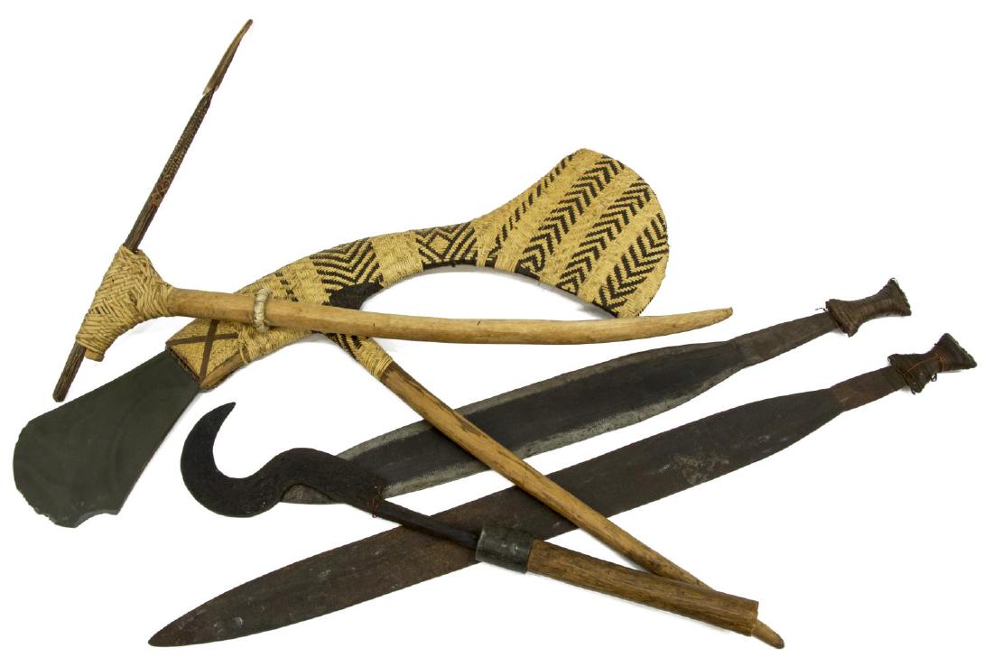 (5) AFRICAN WEAPONS, MACHETES, HOOK, ETC.: (lot of 5) African weapons, including: (2) metal machetes, longest: approx 36.75"l, (1) weapon with bone tip, approx 27.75"l, (1) hook, approx 24"l; (1) flint blade ax with woven cane body, chips and