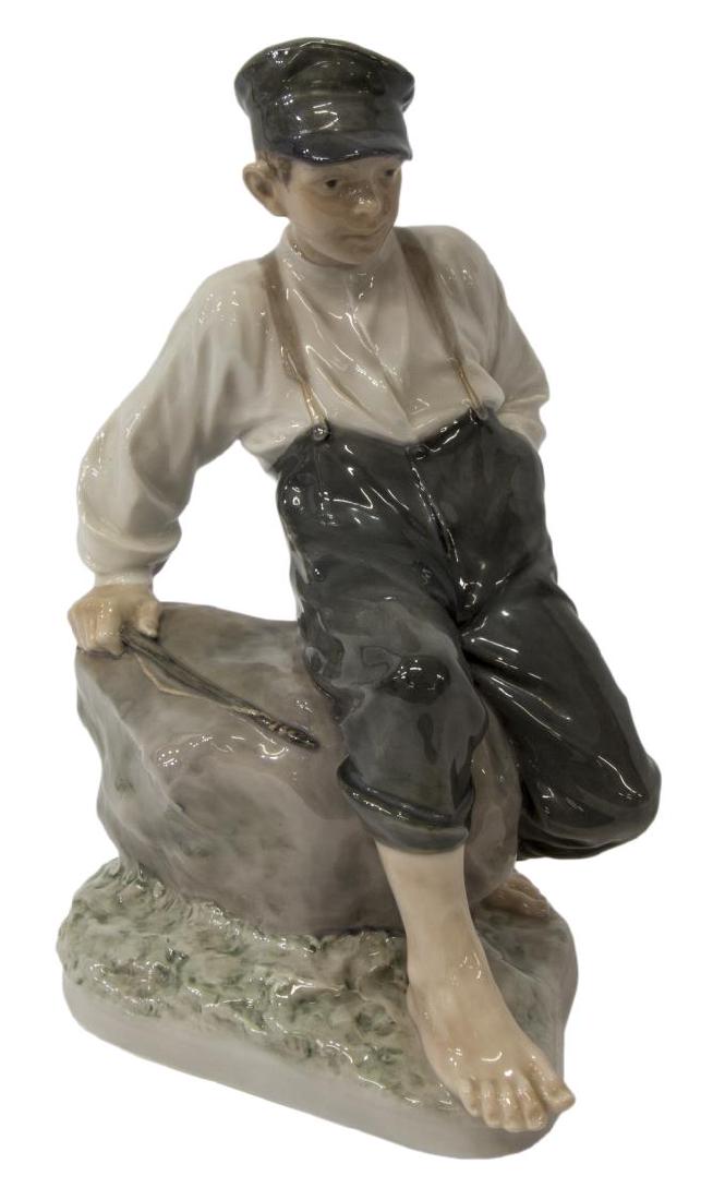 LARGE ROYAL COPENHAGEN SHEPHERD BOY ON ROCK, 1659: Large Royal Copenhagen porcelain figure, Shepherd Boy on Rock, modeled by Christian Thomsen #1659, approx 12.75"h, 7"w, 9"l, 5lbs **Provenance: From a prominent Austin, Texas estate** Start Price: $60