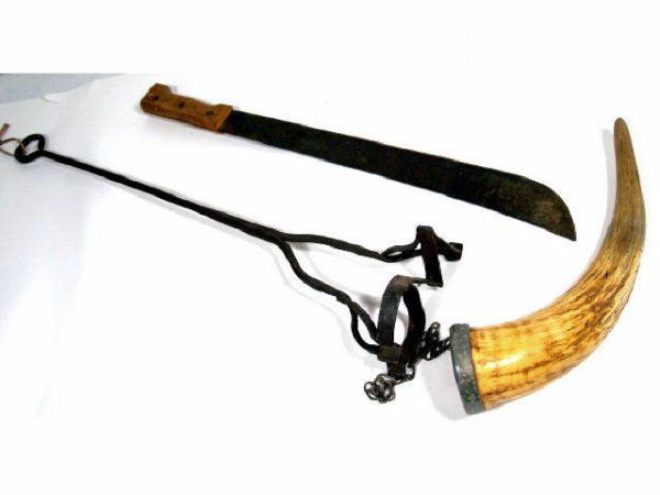 GREASE HORN, MACHETTE, BRANDING IRON: Three pieces with a grease horn (used to store grease for wagon wheel), a machete and branding iron. Machete marked Sheffield and is about 23" x 2.25" x 1", horn about 13.25"H x 3"D, branding iron wit