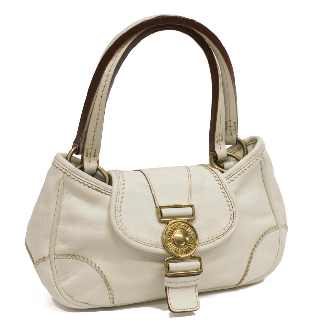 MIU MIU WHITE LEATHER HANDBAG: Miu Miu rectangular handbag in white leather, with gold tone hardware, leather flat top handles on rings, over flap top with magnetic snap closure, tan interior with single zipper pocket, retains dust